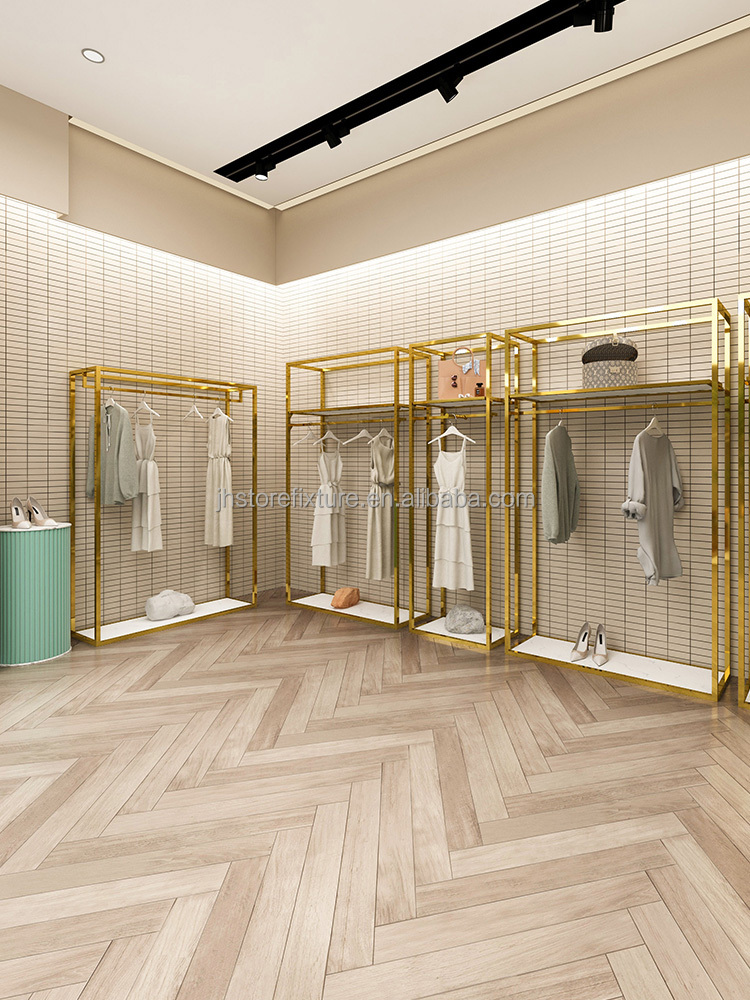 新しいデザイン豪華な壁掛けシャイニーゴールドステンレス鋼は衣料品店のためのロゴ服ディスプレイラックをカスタマイズします