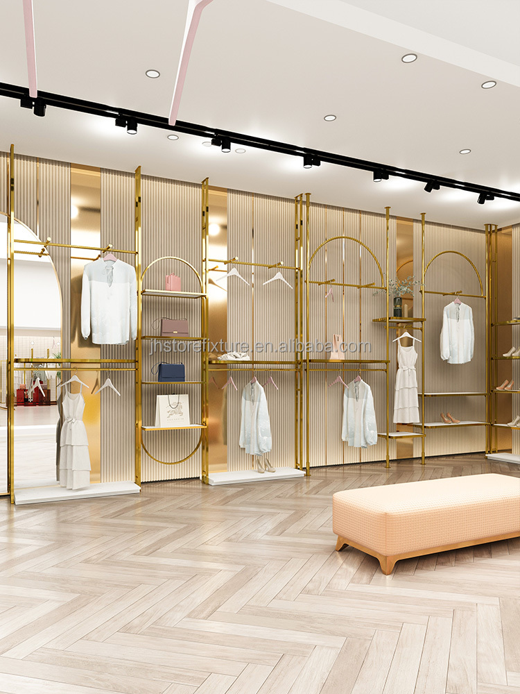 新しいデザイン豪華な壁掛けシャイニーゴールドステンレス鋼は衣料品店のためのロゴ服ディスプレイラックをカスタマイズします
